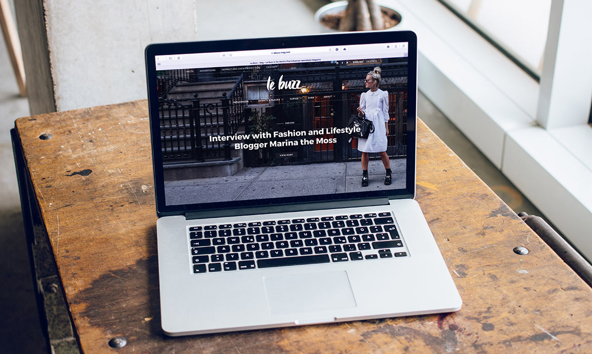 Laptop displaying fashion blog interview page