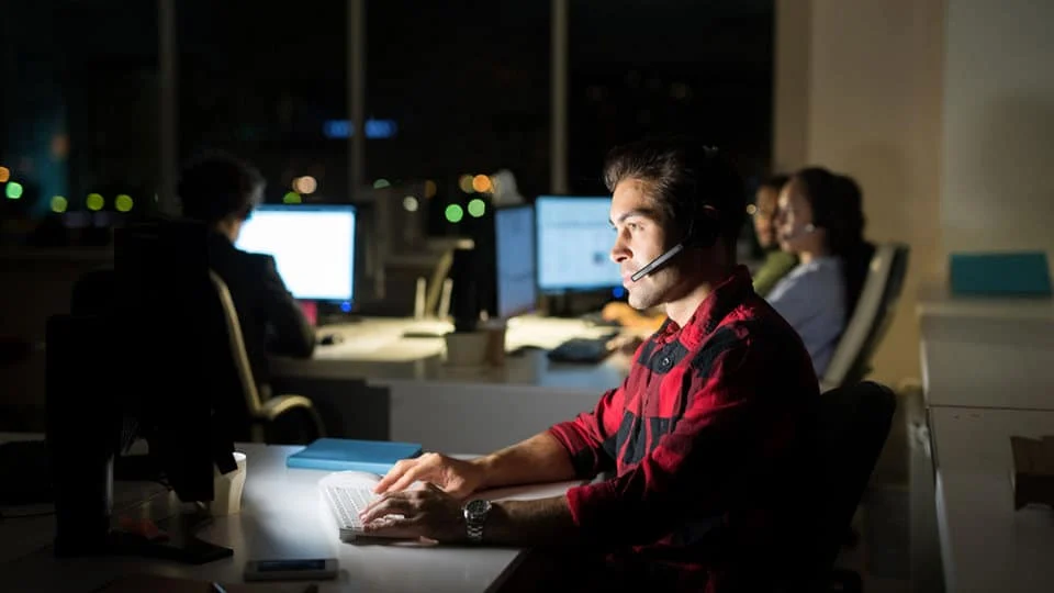 After-hours IT support team working overnight