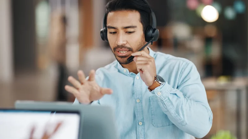 IT support agent assisting a customer via headset