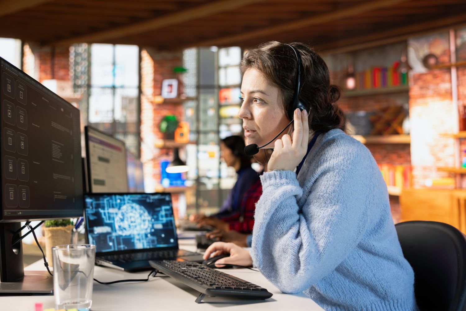 Customer support agent working at a computer
